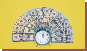 Alarm clock and money on a colored background, conceptual minimalism.